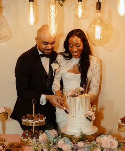 The cake cutting, photographed from a guest's seat